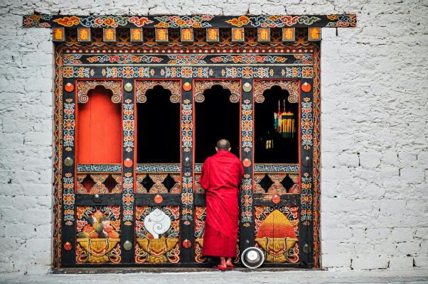 HDBhutanBuddhi Monk Standing by Building